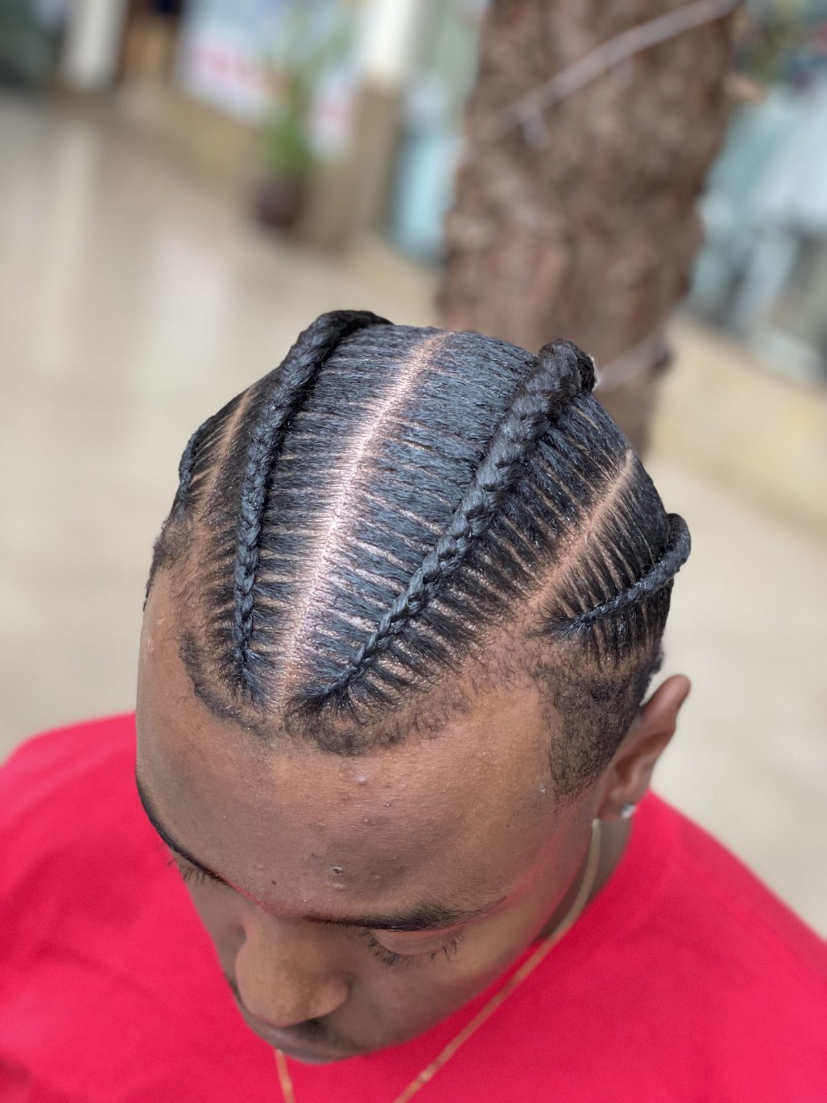 Neat feed-in cornrow pattern styled at the salon