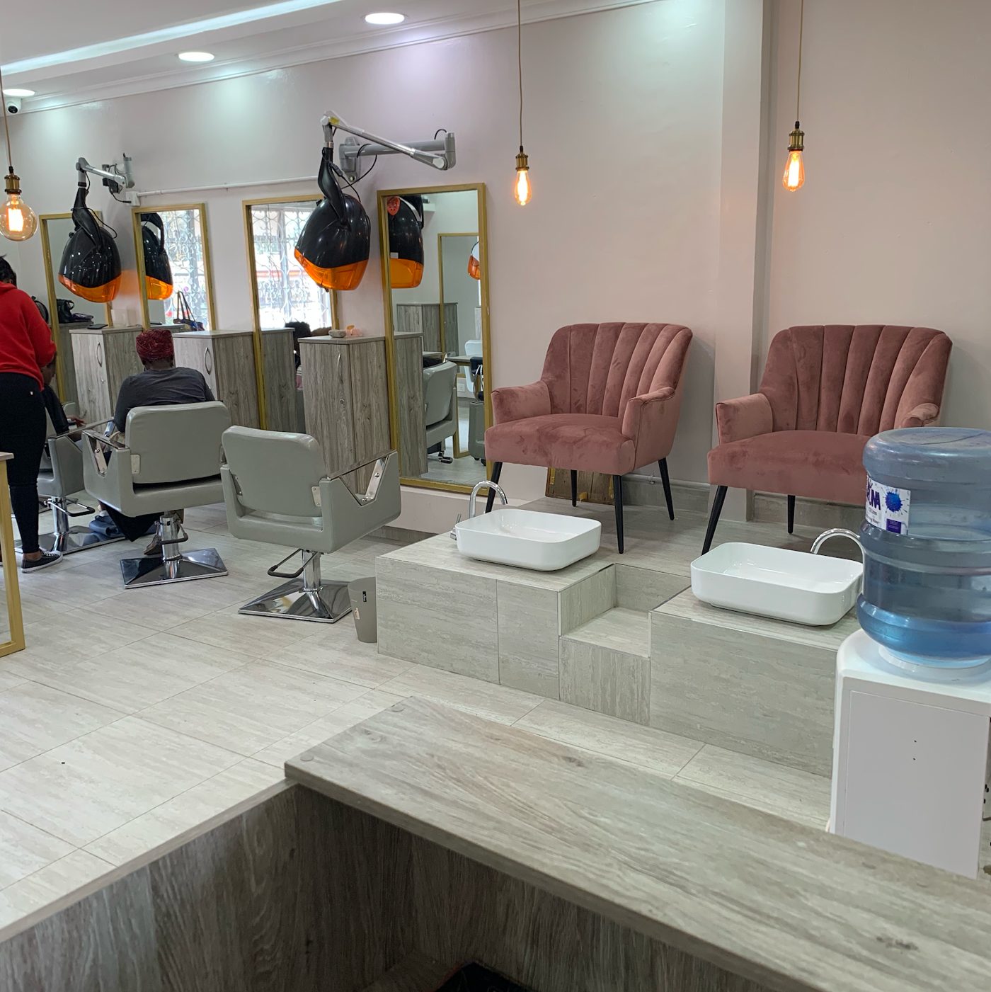 Styling stations and mirrors on the floor at Maya's Salon, Nairobi